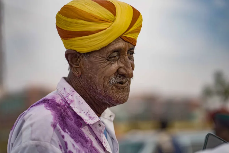 A Rajasthani elder in a saffron and yellow turban
